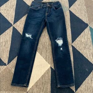 Blue jeans with ripped holes